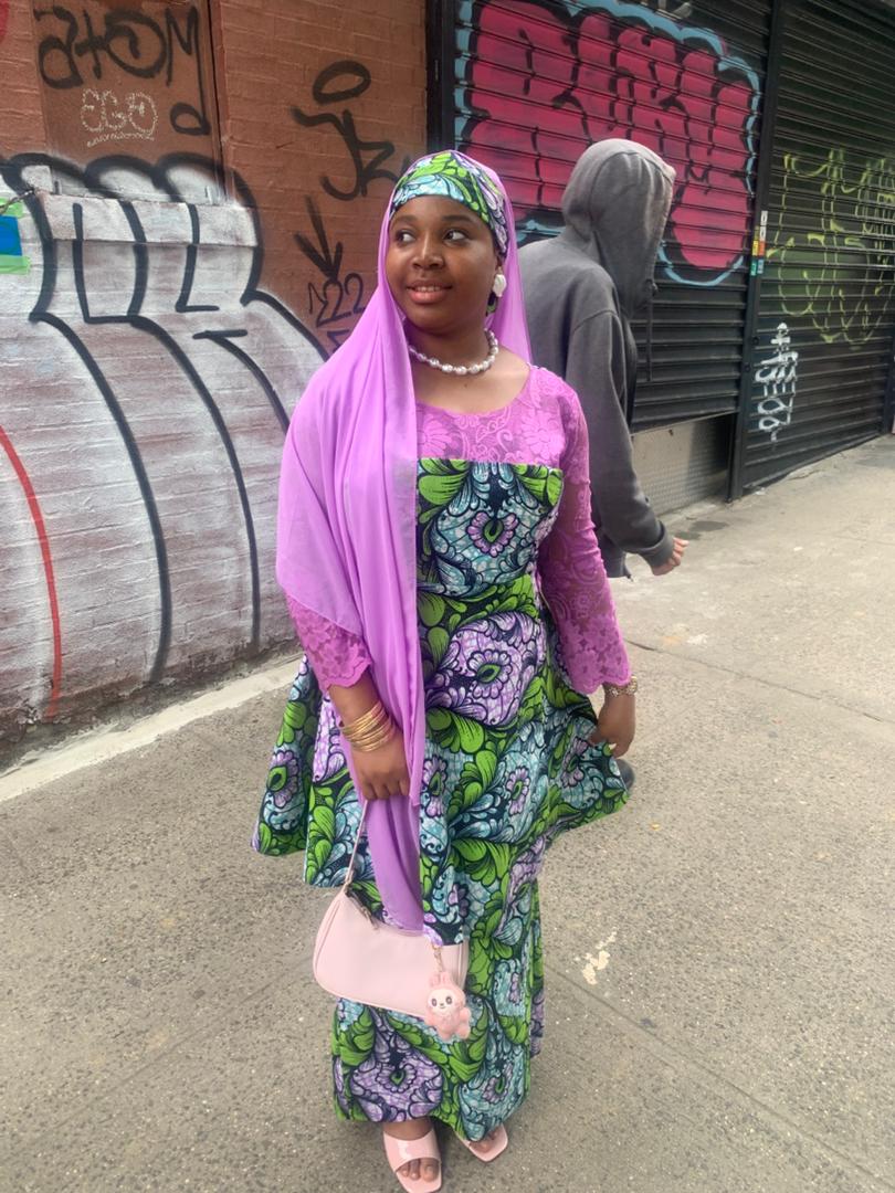 Mashkurah Oumar in her lilac and green African-print outfit